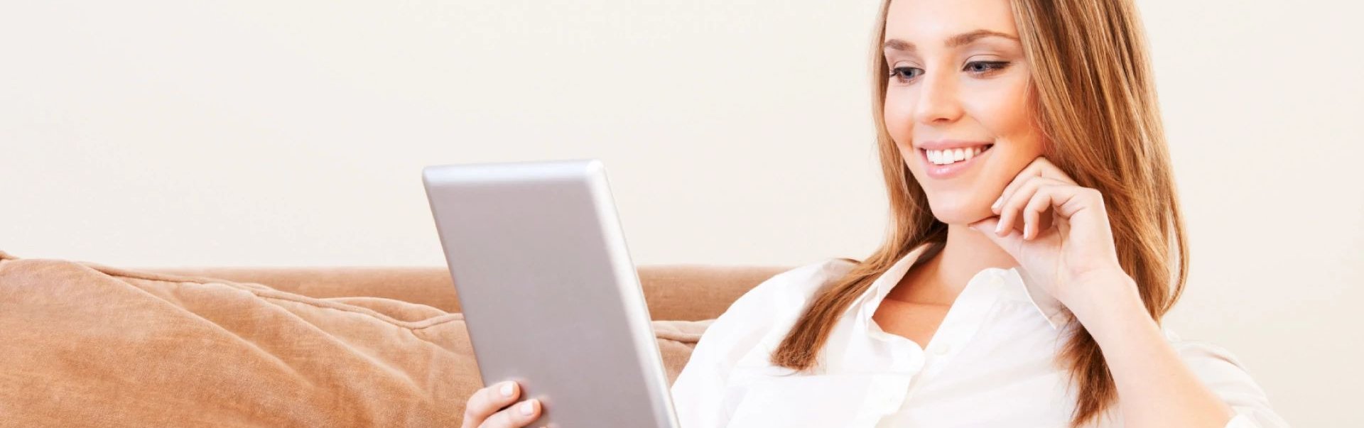 Woman shopping online for flooring in Riverton, WY at Plains Floor & Window Covering